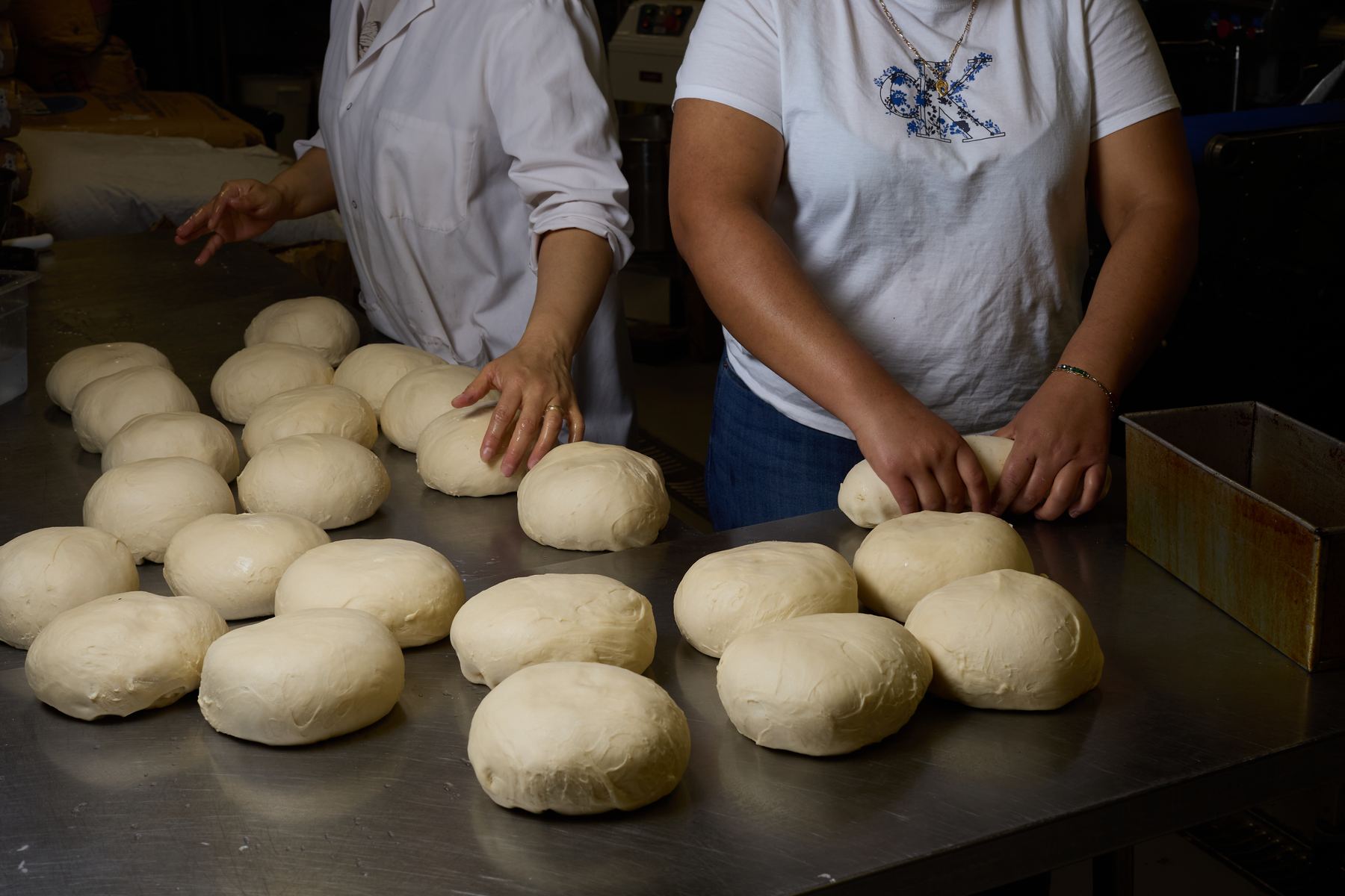 Rows of shaped dough staged for proofing