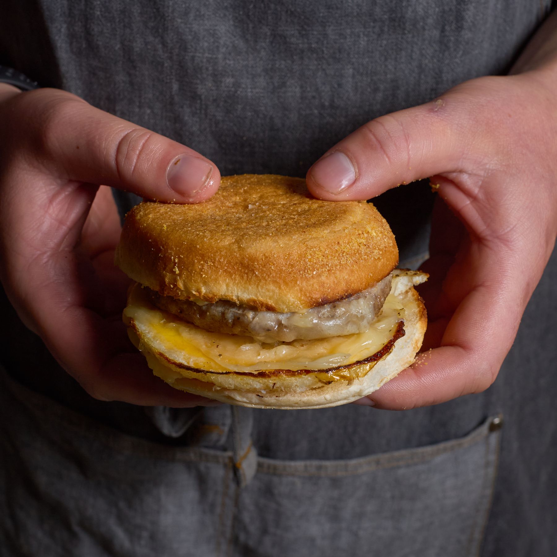 Close-up of a sausage egg and cheese breakfast sandwich